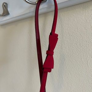 Skinny red Prada belt